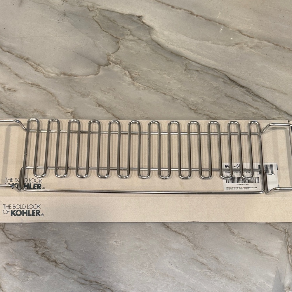 Kohler Silver sink utility shelf with towel bar. Stainless steel